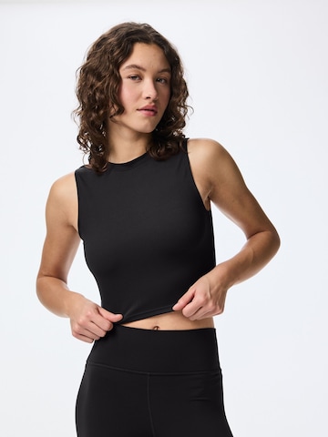 PIECES - Top en negro: frente