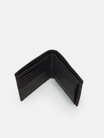 Portamonete di Emporio Armani in nero