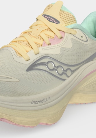 Chaussure de course saucony en beige