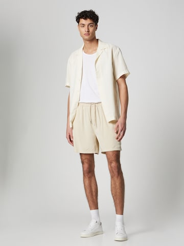 ABOUT YOU x Jaime Lorente Regular Pants 'Julius' in Beige