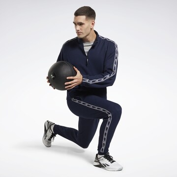 Tapered Pantaloni sportivi di Reebok in blu