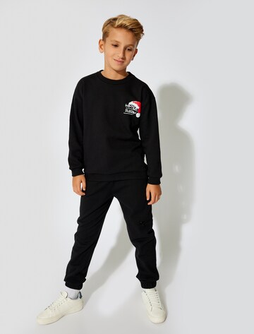 Koton Regular Trousers in Black: front