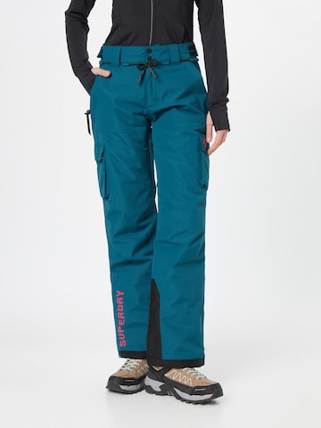 Superdry Snow Regularen Športne hlače 'ULTIMATE RESCUE' | modra barva: sprednja stran