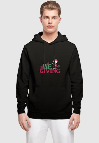 Merchcode Sweatshirt 'Peanuts Be Giving' in Zwart: voorkant