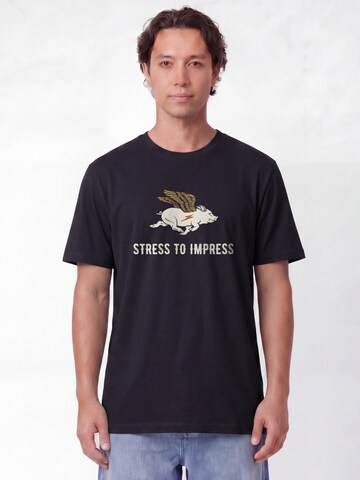 T-Shirt 'Stress To Impress' Watapparel en noir : devant
