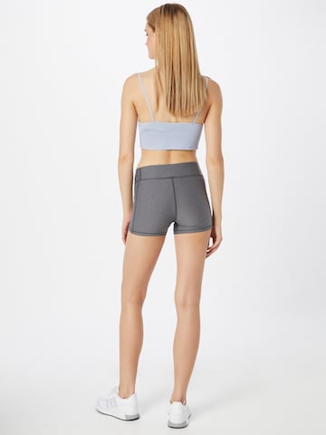 Skinny Pantaloni sportivi di UNDER ARMOUR in grigio