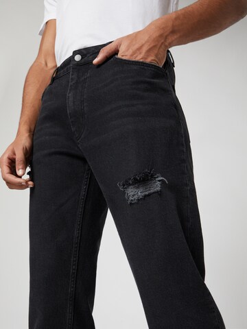 Kosta Williams x About You Regular Jeans in Zwart