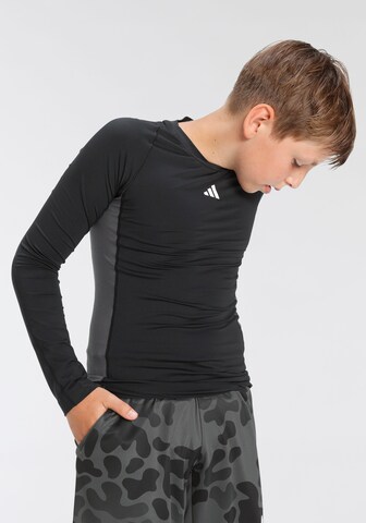 ADIDAS SPORTSWEAR - Camisa funcionais 'Techfit' em preto