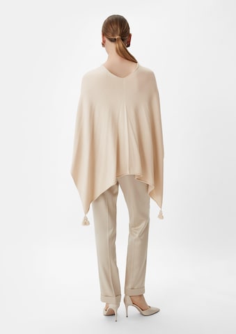 COMMA Cape in Beige: back