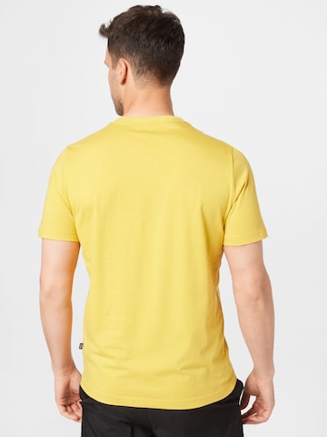 PUMA - Camisa funcionais 'Essentials' em amarelo