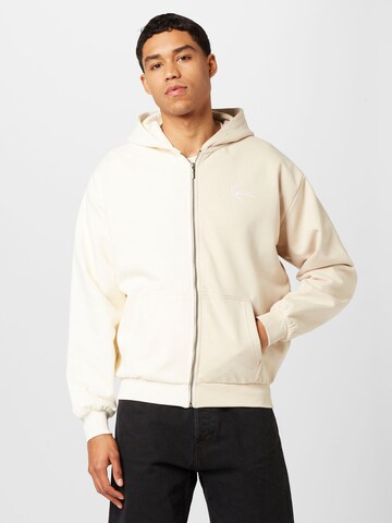 Veste de survêtement Karl Kani en beige : devant