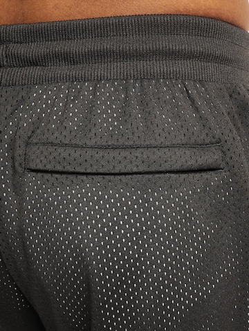 Loosefit Pantaloni sportivi 'Scholarship' di PUMA in nero