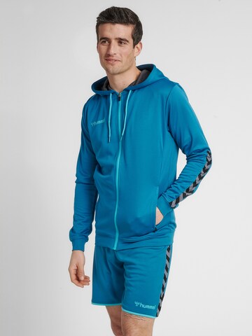 Hummel Sportsweatjacke 'Poly' in Blau: Vorderseite