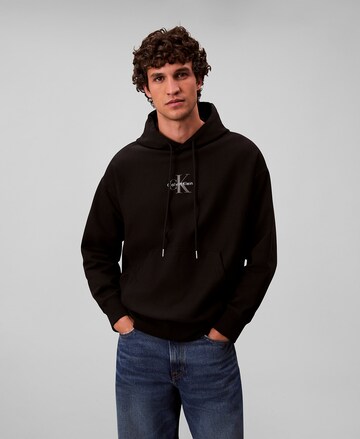Sweat-shirt Calvin Klein Jeans en noir : devant
