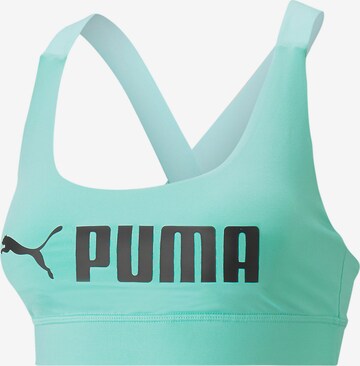 Reggiseno sportivo di PUMA in verde: frontale