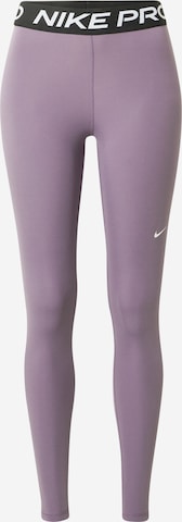 NIKE Skinny Workout Pants in Purple: front