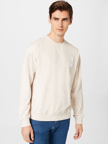 JuviaSweater majica - bež boja: prednji dio