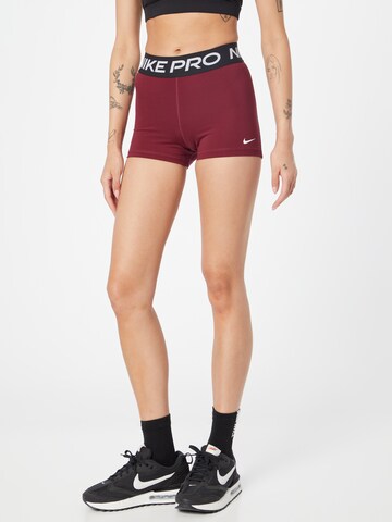 Skinny Pantalon de sport 'Pro' NIKE en rouge : devant