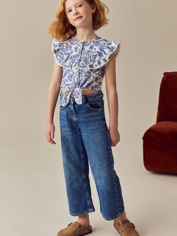 Next Blus i blå: framsida
