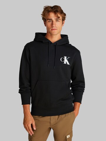 Sweat-shirt Calvin Klein Jeans en noir : devant