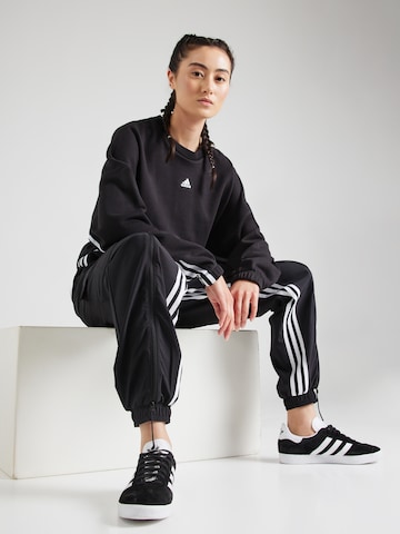 juoda ADIDAS SPORTSWEAR Siaurėjantis Sportinės kelnės 'Dance All-gender Versatile Woven Cargo Bottoms'