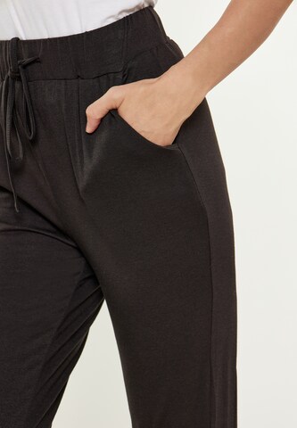 Usha - Tapered Pantalón 'Fashion Look' en negro