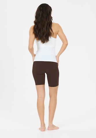 Athlecia Skinny Sportbroek 'Emarri' in Bruin
