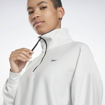 Reebok - Sweatshirt de desporto em cinzento