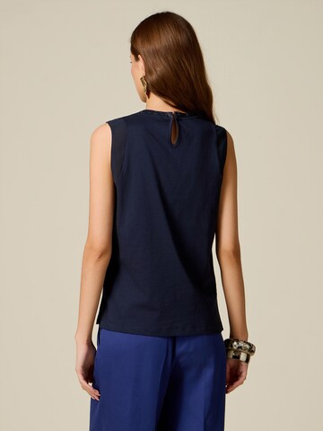 Top di oltre in blu