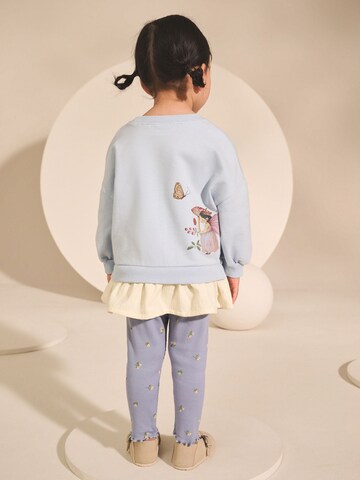 Set Next en bleu