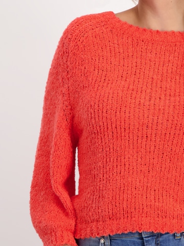 Pullover di monari in arancione