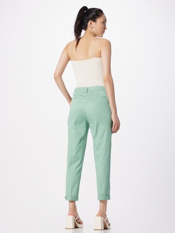 Slimfit Pantaloni con piega frontale di Sisley in verde
