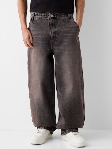 Bershka Wide leg Jeans in Grey: front