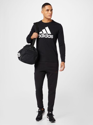 ADIDAS SPORTSWEAR Normalny krój Spodnie sportowe 'Essentials' w kolorze czarny