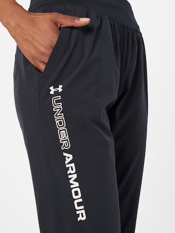 UNDER ARMOUR Regular Urheiluhousut 'Storm' värissä musta