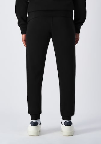 Champion Authentic Athletic Apparel Tapered Pants in Black