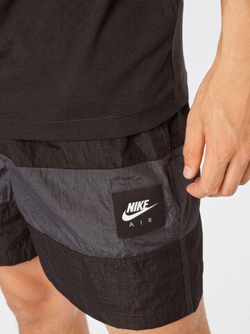 Loosefit Pantalon 'Air' Nike Sportswear en gris