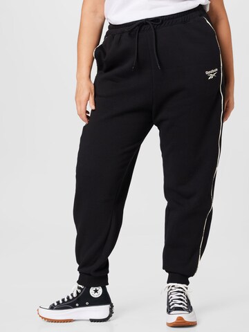 Reebok Tapered Sports trousers 'Piping' in Black: front