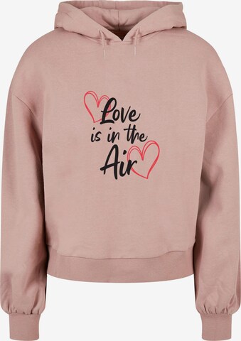 Merchcode Sweatshirt 'Valentines Day - Love is in the Air' in Roze: voorkant