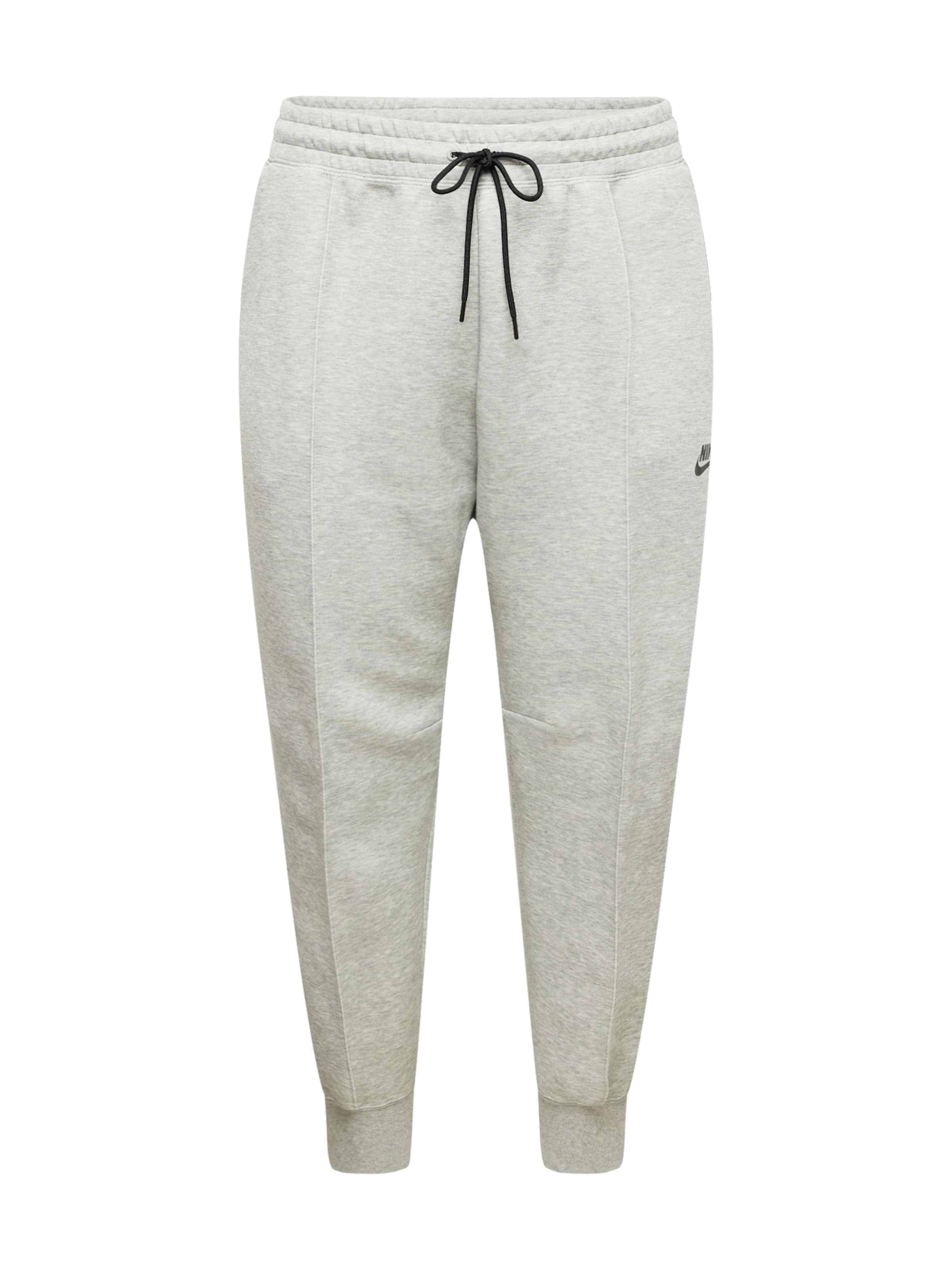 Tapered Pantaloni sport de la Nike Sportswear pe gri: față