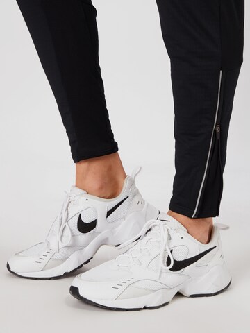 NIKE Slimfit Spodnie sportowe 'Phenom Elite' w kolorze czarny