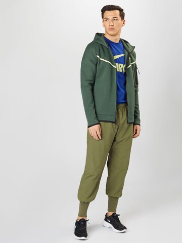 Effilé Pantalon de sport NIKE en vert