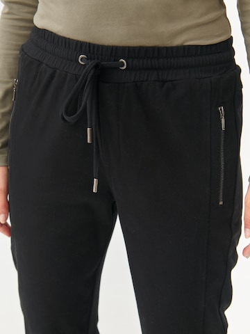 Regular Pantalon 'SAZIRI' TATUUM en noir