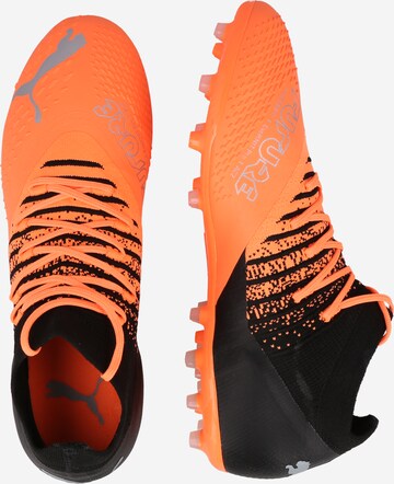 PUMA Jalkapallokengät 'FUTURE Z 3.3' värissä oranssi