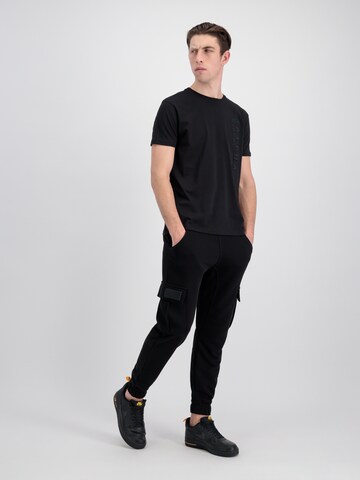 Effilé Pantalon ALPHA INDUSTRIES en noir