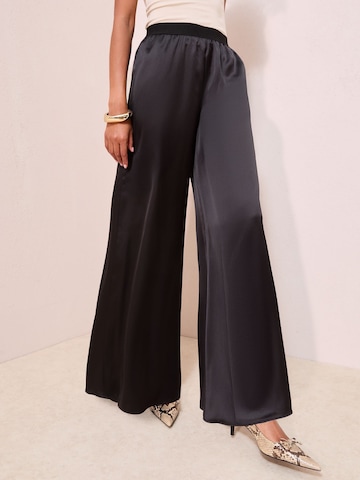 Friends Like These Szeroka nogawka Spodnie w kolorze czarny: przód