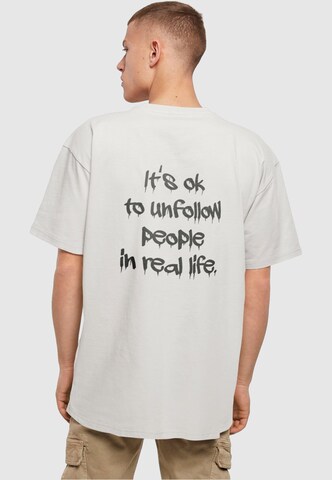 T-Shirt 'Unfollow' Merchcode en gris : devant