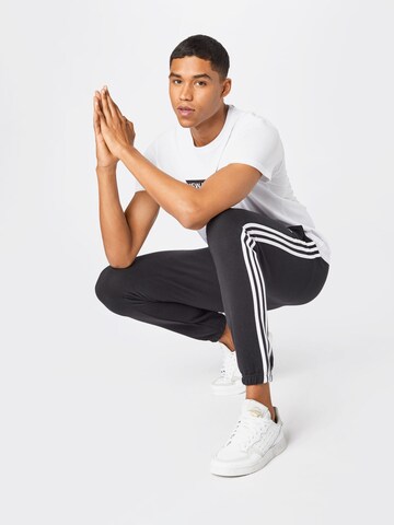 ADIDAS SPORTSWEAR Tapered Workout Pants 'Essentials French Terry Tapered 3-Stripes' in Black