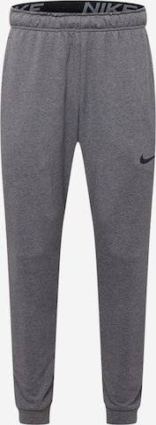 Pantalon de sport NIKE en gris : devant