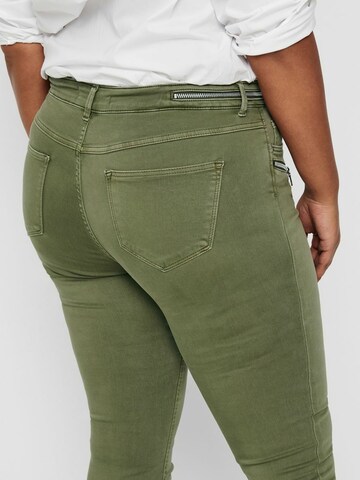 Skinny Jeans di ONLY Carmakoma in verde